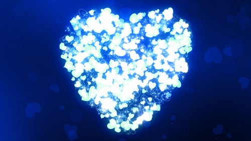 Animated Glowing Blue Heart Particles Loop Background