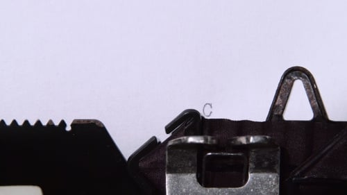 Confidential Message Being Typed on Typewriter