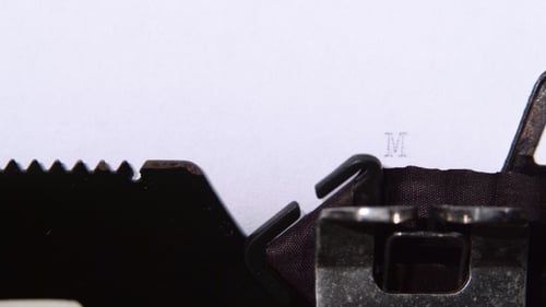 Typewriter Types the Word 'Marketing' Close Up