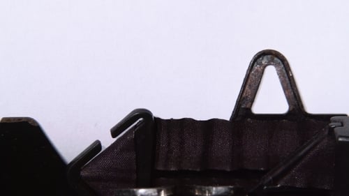 Typewriter Writing the Word Time Close Up