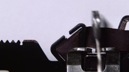Director of the Firm Writes the Word of Innovation on a Typewriter