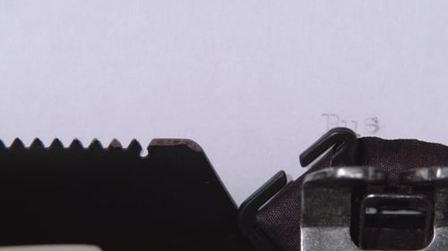 Typewriter Types Business Driven Plan onto Paper