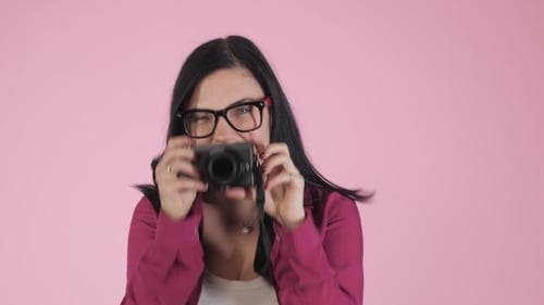 Woman Posing and Taking Photos with Camera