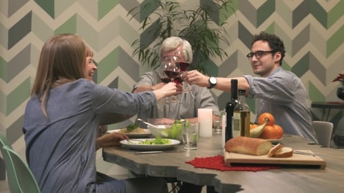 Family and Friends Toasting with Wine at Dinner