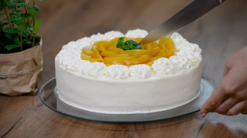 Cutting Slice of Delicious Peach Cake