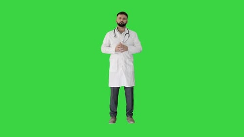 Confident Turk Doctor Standing and Looking To Camera on a Green Screen, Chroma Key.