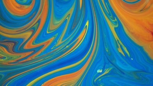 Footage. Ink in Water. Blue and Orange Ink Reacting in Water Creating Abstract Background.