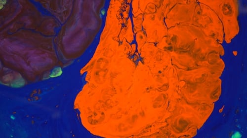 Colour Ink Reacting in Water Creating Abstract Background