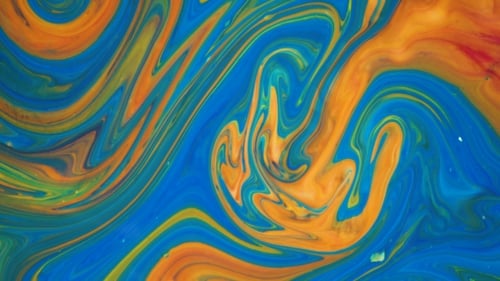 Footage. Ink in Water. Blue and Orange Ink Reacting in Water Creating Abstract Background