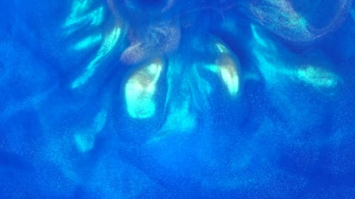 Blue Ink Reacting in Water Creating Abstract Background.