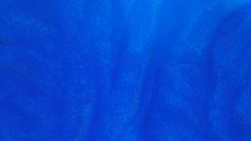 Sparkling Blue Liquid Moving Abstractly