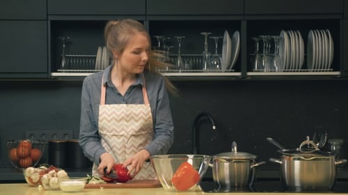 Woman Cooking Vegetables in Modern Kitchen