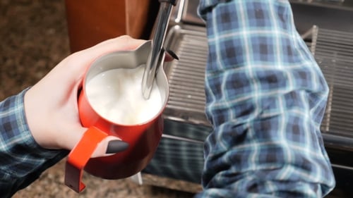 Coffee house Barista Making Cappuccino Making Espresso and Steam Milk Barista at Work Preparing