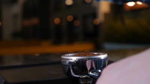 Coffee House. Coffee Making. Barista at Coffee shop.Tamping Fresh Ground coffee.Barista Is Preparing