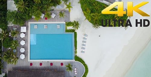 Aerial Shot of Girl Relaxing in Bikini on Overwater Sun Lounger in Luxury Resort