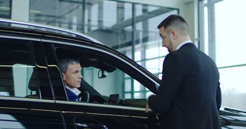 Manager Talking To Client in Showroom