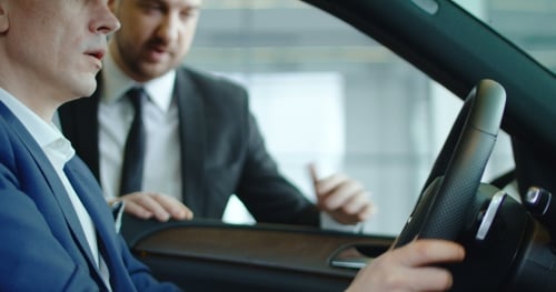 Two Men Talking in Car About Technology