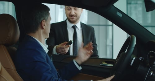 Sales Manager Gives Key To Customer