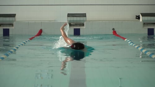 Athlete Swimmer Swims in the Pool
