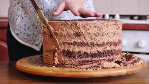 Woman Frosting Delicious Chocolate Layer Cake Dessert