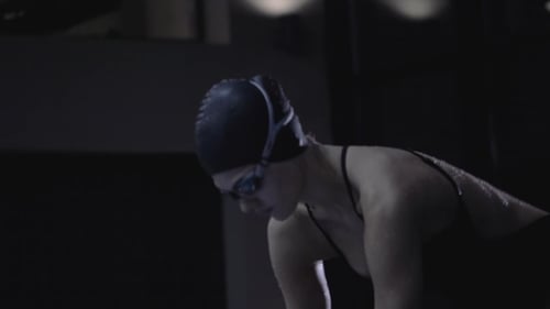 Woman Swimmer on Start Diving in Deep Water in Floating Pool