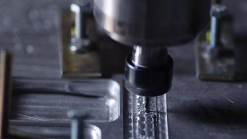 Milling Machine for Cutting Steel Handles a Piece of Aluminum The Drill Cuts the Inscription on the