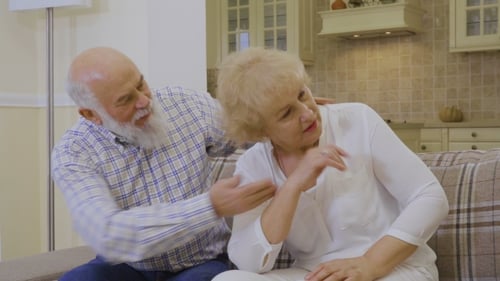 Senior Woman Crying During Quarreling with Her Husband