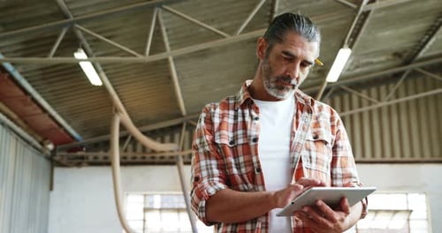 Carpenter Uses Tablet in Workshop