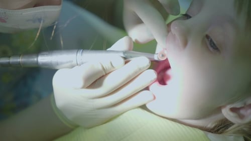 Medical Office. The Dentist Is Treating the Teeth To the Child