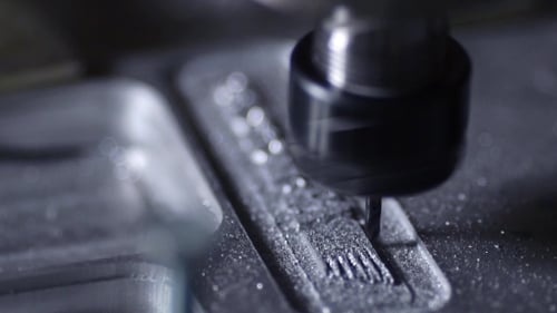 The Plant for the Production of Metal Products Using a Lathe Creates a Lid for the Case of a Laptop