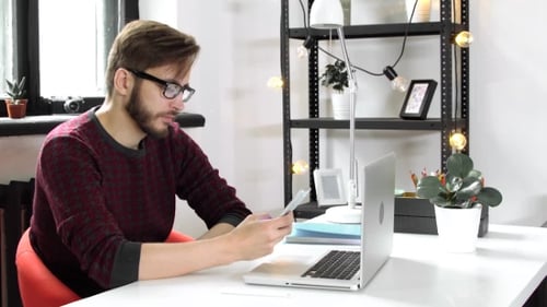 Man Using Smartphone and Chatting, Rest in Office