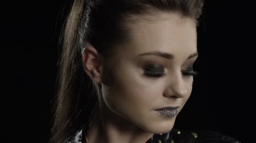 Woman with Glitter Makeup and Punk Style