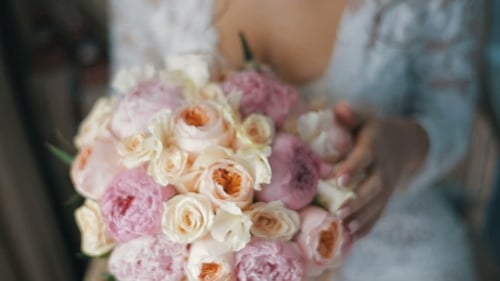 Bride Holding Beautiful Bouquet of Pink and White Flowers