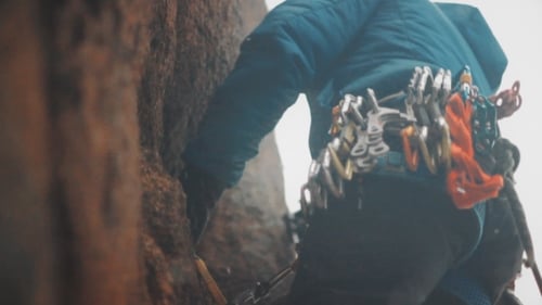 Person Rock Climbing Outdoors