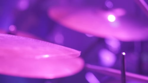 Musician Playing Drums During Rock Concert