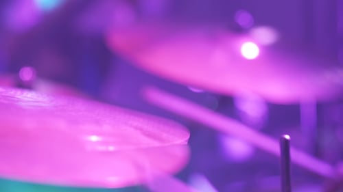 Musician Playing Drums During Rock Concert