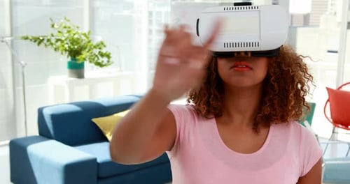 Woman Using Virtual Reality Headset Indoors