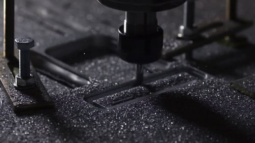The Plant for the Production of Metal Products Using a Lathe Creates a Lid for the Case of a Laptop