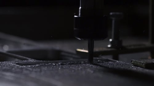 The Plant for the Production of Metal Products Using a Lathe Creates a Lid for the Case of a Laptop