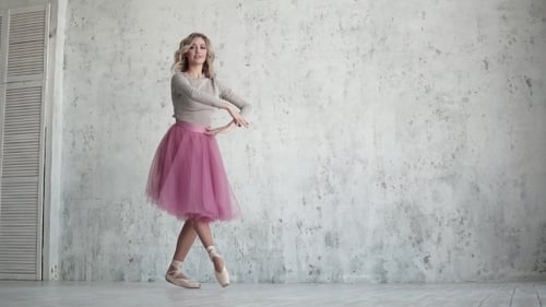 Elegant Ballerina Dancing in a Bright Studio