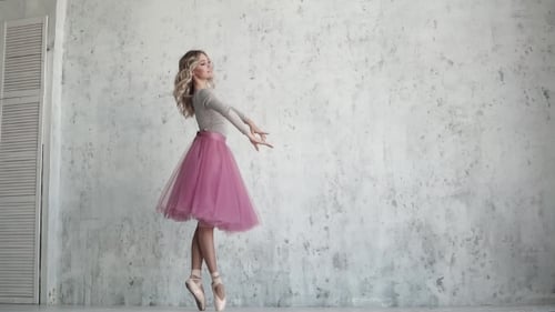 Blonde Ballerina Dancing in White Studio