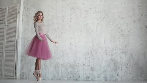 Dancer Ballet Pirouette on Toes in Pointe Shoes. Ballet Dancer in a Pink Tutu.