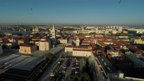 Aerial view of a city square in the sunlight