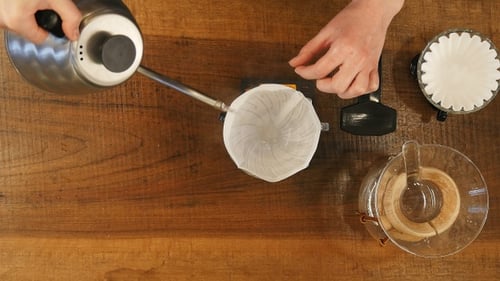 Hands Making Pour Over Coffee at Home