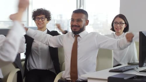 Office Workers Stretching During a Break At Work