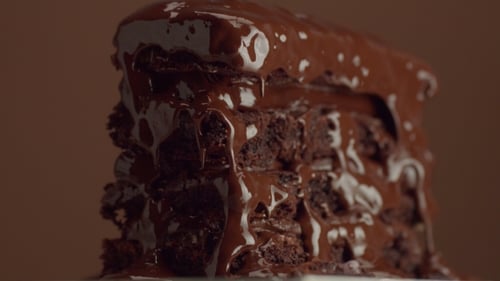 Chocolate Layer Cake Dripping with Glossy Fudge Sauce