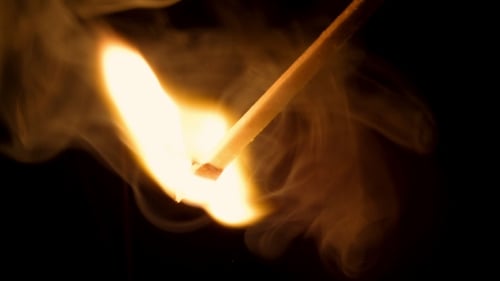 Wooden Matchstick Ignites with Bright Flame and Smoke
