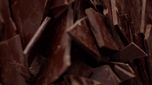 Chunks of Dark Chocolate in a Close Up Shot