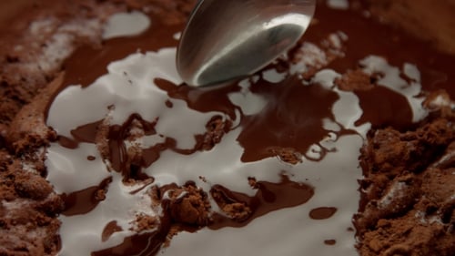 Chocolate Being Mixed With a Spoon in Bowl
