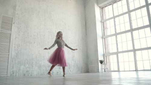 Graceful Young Ballerina Dancing in a Classic Tutu and Pointes